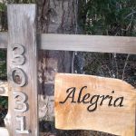 Alegria sign and street number 3031