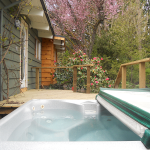 Outdoor hot tub beside the suite